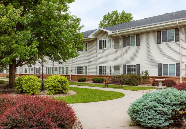 Landscaped Grounds with a Walking Path at an Assisted Living Community Landscaped Grounds with a Walking Path at an Assisted Living Community