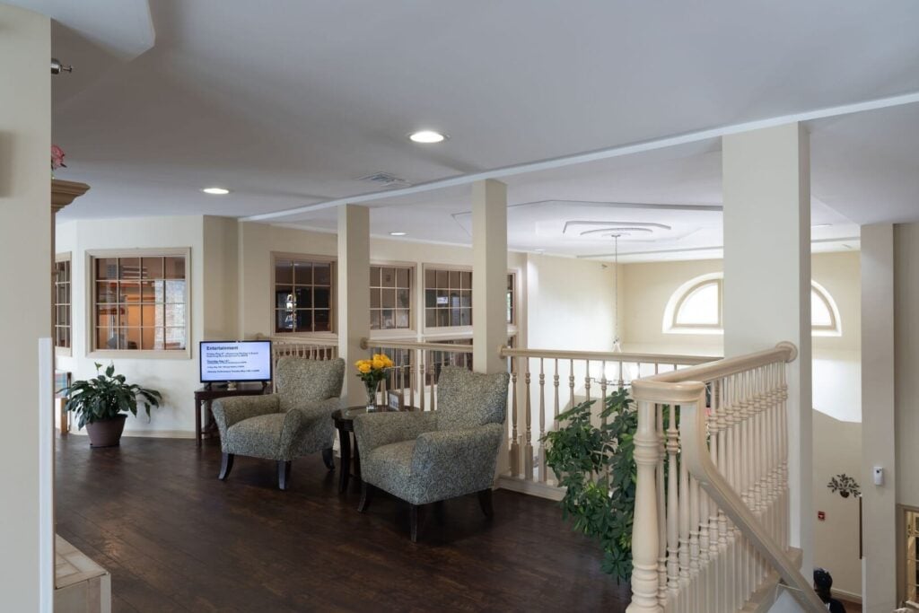 Upper Level Lounge near a Staircase at an Assisted Living Community