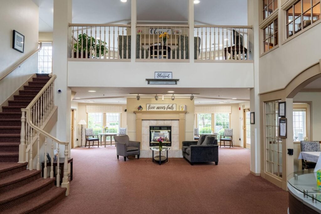 Two-Story Lobby with a Fireplace at an Assisted Living Community