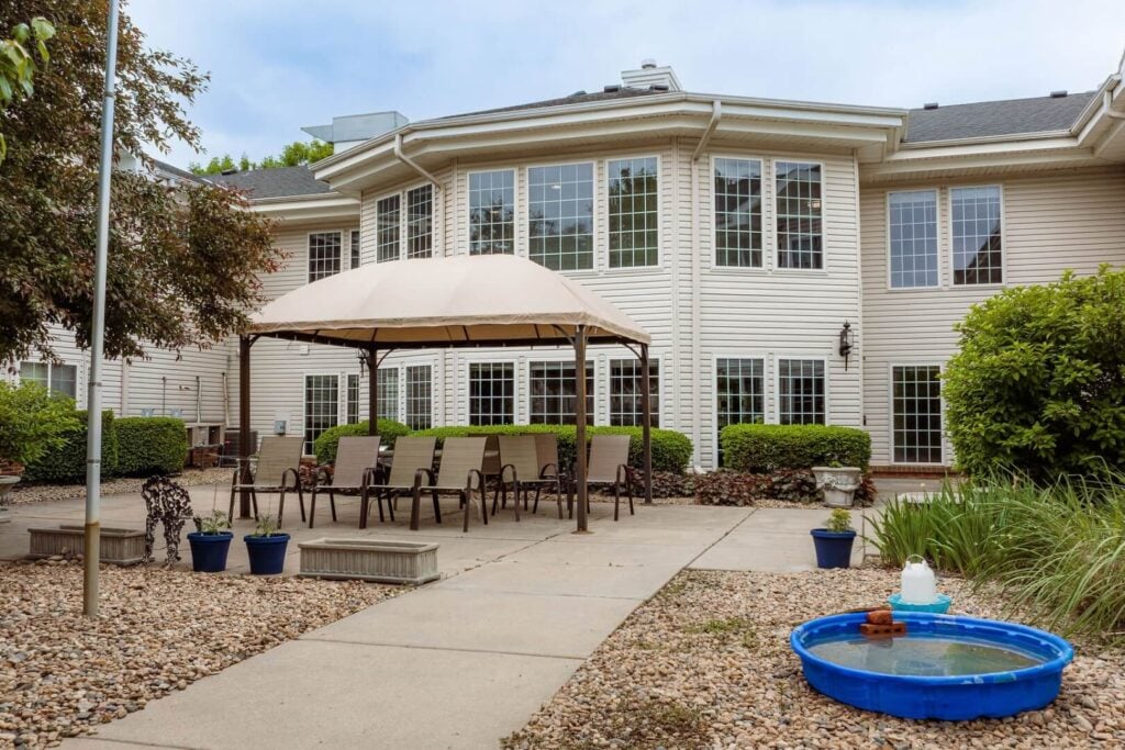 Outdoor Patio with Shaded Seating at an Assisted Living Community
