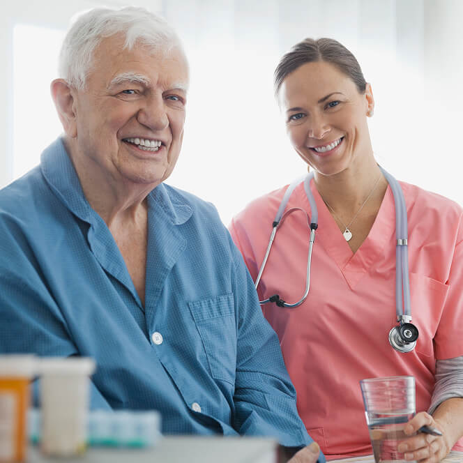 Caregiver Comforting Resident at Memory Care Facility